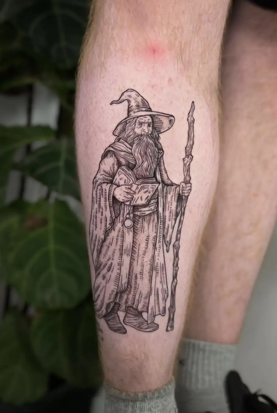Fantasy wizard character tattoo with detailed line work by Ayah at Omnia Tattoo Melbourne